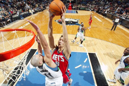MINNEAPOLIS - OCTOBER 28: Yi JIanlian #9 of the New Jersey Nets shoots against Sasha Pavlovic #11 of the Minnesota Timberwolves during the season opening game on October 28, 2009 at the Target Center in Minneapolis, Minnesota.  <br /><br /><span class="help">(Photo by David Sherman/NBAE via Getty Images)</span>