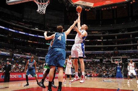 LOS ANGELES - NOVEMBER 2:  Chris Kaman #35 of the Los Angeles Clippers puts up a shot against Oleksiy Pecherov #4 of the Minnesota Timberwolves at Staples Center on November 2, 2009 in Los Angeles, California. <br /><br /><span class="help">(Photo by Andrew D. Bernstein/NBAE via Getty Images)</span>
