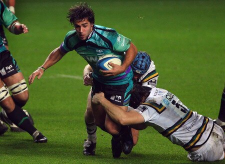 SWANSEA, WALES - NOVEMBER 05:  Ospreys fly half Gareth Owen is tackled by the Saints defence during the LV = Anglo Welsh cup match between Ospreys and Northampton Saints at the Liberty Stadium on November 5, 2009 in Swansea, Wales.  <br /><br /><span class="help">(Photo by Stu Forster/Getty Images)</span>