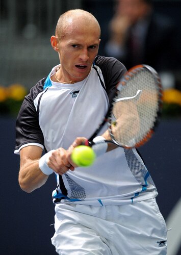 VALENCIA, SPAIN - NOVEMBER 05:  Nikolay Davydenko of Russia hits a double handed backhand in his second round match against Juan Monaco of Argentina during the ATP 500 World Tour Valencia Open tennis tournament at the Ciudad de las Artes y las Ciencias on November 5, 2009 in Valencia, Spain.  Davydenko won the match in two sets, 6-3 and 7-5.  <br /><br /><span class="help">(Photo by Jasper Juinen/Getty Images)</span>