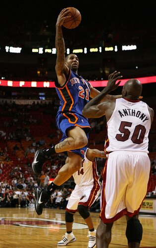 MIAMI - OCTOBER 28:  Wilson Chandler #21 of the New York Knicks shoots over Joel Anthony #50 of the Miami Heat at AmericanAirlines Arena on October 28, 2009 in Miami, Florida. The Heat defeated the Knicks 115-93. <br /><br /><span class="help">(Photo by Doug Benc/Getty Images)</span>
