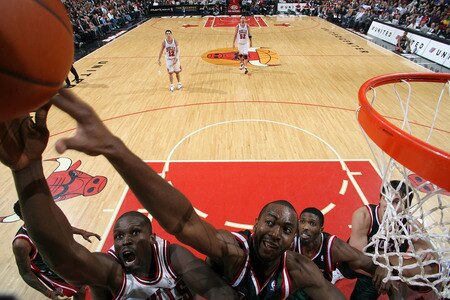 CHICAGO - NOVEMBER 03:  Luol Deng #9 of the Chicago Bulls shoots a layup against Luc Richard Mbah a Moute #12 of the Milwaukee Bucks on November 3, 2009 at the United Center in Chicago, Illinois.  <br /><br /><span class="help">(Photo by Gary Dineen/NBAE via Getty Images)</span>