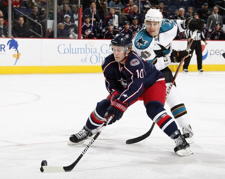 COLUMBUS, OH - NOVEMBER 04:  Kris Russell #10 of the Columbus Blue Jackets controls the puck against Jed Ortmeyer #41 the San Jose Sharks on November 4, 2009 at Nationwide Arena in Columbus, Ohio. San Jose won the game 3-2 in a shootout.  <br /><br /><span class="help">(Photo by Gregory Shamus/Getty Images)</span>