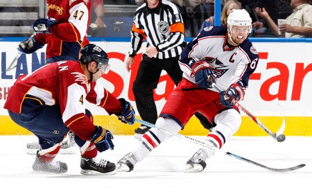 ATLANTA - NOVEMBER 05:  Rick Nash #61 of the Columbus Blue Jackets passes the puck in front of Zach Bogosian #4 of the Atlanta Thrashers at Philips Arena on November 5, 2009 in Atlanta, Georgia.  <br /><br /><span class="help">(Photo by Kevin C. Cox/Getty Images)</span>