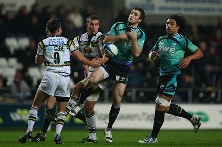 SWANSEA, WALES - NOVEMBER 05:  Ospreys centre Andrew Bishop (c) contests a high ball with Mark Easter of the saints during the LV = Anglo Welsh cup match between Ospreys and Northampton Saints at the Liberty Stadium on November 5, 2009 in Swansea, Wales.  <br /><br /><span class="help">(Photo by Stu Forster/Getty Images)</span>