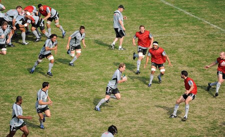 TOKYO - OCTOBER 29:  Andy Ellis (C) runs the ball at the opposition during a New Zealand All Blacks training session at Kubota Spears Rugby Field in Chiba on October 29, 2009 in Funabashi, Japan.  <br /><br /><span class="help">(Photo by Ross Land/Getty Images)</span>
