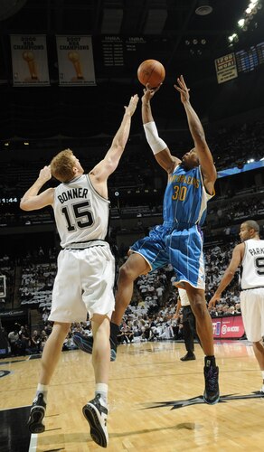 SAN ANTONIO - OCTOBER 28: David West #30 of the New Orleans Hornets shoots over Matt Bonner #15 of the San Antonio Spurs on October 28, 2009 at the AT&T Center in San Antonio, Texas. <br /><br /><span class="help">(Photo by D. Clarke Evans/NBAE via Getty Images)</span>