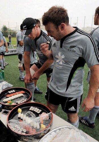 TOKYO - OCTOBER 29:  Brad Thorn (L) and Andrew hore snack on sushi following a New Zealand All Blacks training session at Kubota Spears Rugby Field in Chiba on October 29, 2009 in Funabashi, Japan.  <br /><br /><span class="help">(Photo by Ross Land/Getty Images)</span>