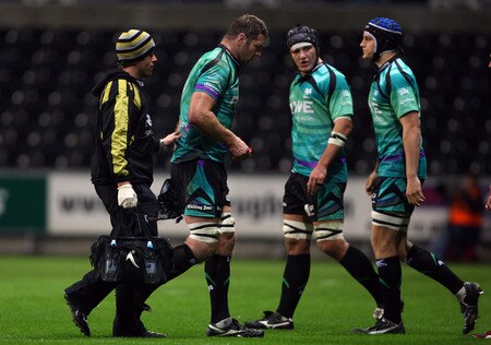 SWANSEA, WALES - NOVEMBER 05:  Ospreys forward Ian Gough (2nd left) is taken off the field after injuring his shoulder during the LV = Anglo Welsh cup match between Ospreys and Northampton Saints at the Liberty Stadium on November 5, 2009 in Swansea, Wales.  <br /><br /><span class="help">(Photo by Stu Forster/Getty Images)</span>
