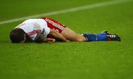 HAMBURG, GERMANY - NOVEMBER 05:  Joris Mathijsen of HSV lies injured on the pitch during the UEFA Europa League Group C match between Hamburger SV and Cletic FC at HSH Nordbank Arena on November 05, 2009 in Hamburg, Germany.  <br /><br /><span class="help">(Photo by Martin Rose/Bongarts/Getty Images)</span>