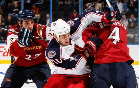 ATLANTA - NOVEMBER 05:  Jared Boll #40 of the Columbus Blue Jackets skates through Chris Thorburn #27 and Zach Bogosian #4 of the Atlanta Thrashers at Philips Arena on November 5, 2009 in Atlanta, Georgia.  <br /><br /><span class="help">(Photo by Kevin C. Cox/Getty Images)</span>