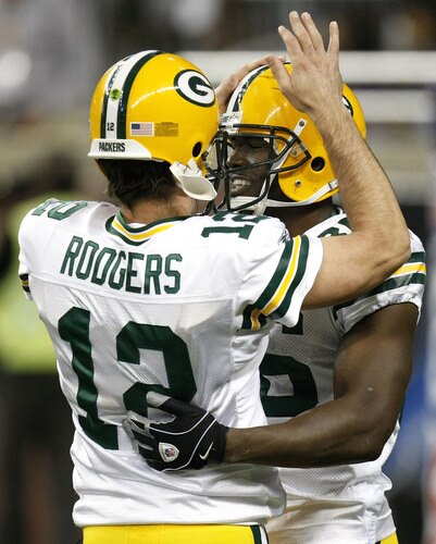 DETROIT , MI - NOVEMBER 26: Donald Lee #86 of the Green Bay Packers celebrates a first second quarter touchdown with Aaron Rodgers #12 while playing the Detroit Lions on November 26, 2009 at Ford Field in Detroit, Michigan.  <br /><br /><span class="help">(Photo by Gregory Shamus/Getty Images)</span>