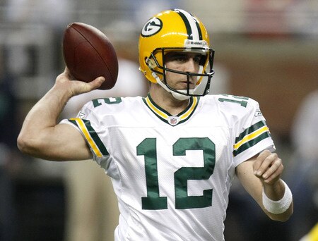DETROIT , MI - NOVEMBER 26:  Aaron Rodgers #12 of the Green Bay Packers throws a second quarter touchdown against the Detroit Lions on November 26, 2009 at Ford Field in Detroit, Michigan.  <br /><br /><span class="help">(Photo by Gregory Shamus/Getty Images)</span>