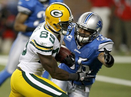 DETROIT , MI - NOVEMBER 26:  James Jones #89 of the Green Bay Packers runs for a third quarter touchdown past Larry Foote #55 of the Detroit Lions on November 26, 2009 at Ford Field in Detroit, Michigan. Green Bay won the game 34-12.  <br /><br /><span class="help">(Photo by Gregory Shamus/Getty Images)</span>