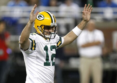 DETROIT , MI - NOVEMBER 26: Aaron Rodgers #12 of the Green Bay Packers reacts after throwing a second quarter touchdown against the Detroit Lions on November 26, 2009 at Ford Field in Detroit, Michigan.  <br /><br /><span class="help">(Photo by Gregory Shamus/Getty Images)</span>