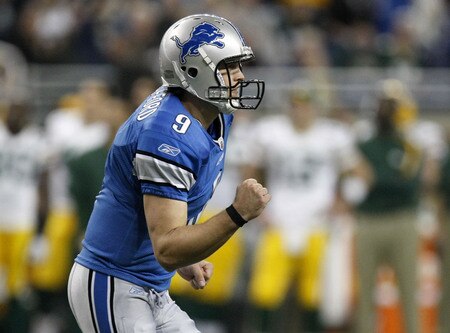 DETROIT , MI - NOVEMBER 26:  Matthew Stafford #9 of the Detroit Lions reacts after throwing a first quarter touchdown while playing the Green Bay Packers on November 26, 2009 at Ford Field in Detroit, Michigan.  <br /><br /><span class="help">(Photo by Gregory Shamus/Getty Images)</span>