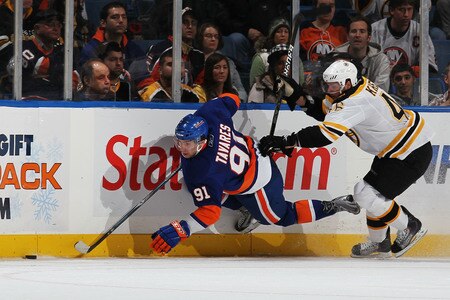 UNIONDALE, NY - DECEMBER 12:  John Tavares #91 of the New York Islanders is checked by David Krejci #46 of the Boston Bruins during their game at the Nassau Coliseum on December 12, 2009 at the Nassau Coliseum in Uniondale, New York.  <br /><br /><span class="help">(Photo by Al Bello/Getty Images)</span>