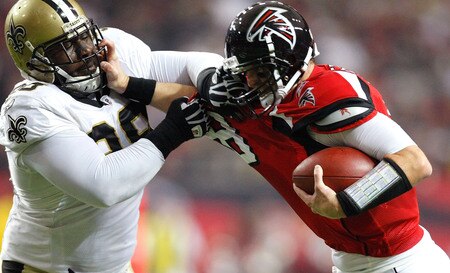 ATLANTA - DECEMBER 13:  Sedrick Ellis #98 of the New Orleans Saints tackles quarterback Chris Redman #8 of the Atlanta Falcons at Georgia Dome on December 13, 2009 in Atlanta, Georgia. The Saints won 26-23. <br /><br /><span class="help">(Photo by Kevin C. Cox/Getty Images)</span>