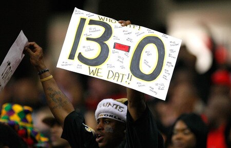 ATLANTA - DECEMBER 13:  A fan of the New Orleans Saints holds up a sign with "13-0" written on it during the game against the Atlanta Falcons at Georgia Dome on December 13, 2009 in Atlanta, Georgia. The Saints won 26-23. <br /><br /><span class="help">(Photo by Kevin C. Cox/Getty Images)</span>