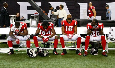 ATLANTA - DECEMBER 13:  Jason Snelling #44, Roddy White #84, Michael Jenkins #12 and Marty Booker #80 of the Atlanta Falcons sit dejected on the bench after their 26-23 loss to the New Orleans Saints at Georgia Dome on December 13, 2009 in Atlanta, Georgia.  <br /><br /><span class="help">(Photo by Kevin C. Cox/Getty Images)</span>