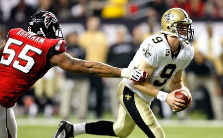 ATLANTA - DECEMBER 13:  John Abraham #55 of the Atlanta Falcons pressures quarterback Drew Brees #9 of the New Orleans Saints at Georgia Dome on December 13, 2009 in Atlanta, Georgia.  <br /><br /><span class="help">(Photo by Kevin C. Cox/Getty Images)</span>
