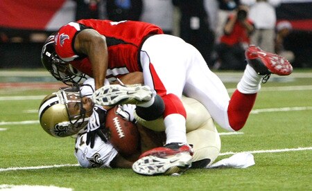 ATLANTA - DECEMBER 13:  Robert Meachem #17 of the New Orleans Saints is tackled by Chris Owens #21 of the Atlanta Falcons at Georgia Dome on December 13, 2009 in Atlanta, Georgia. The Saints won 26-23. <br /><br /><span class="help">(Photo by Kevin C. Cox/Getty Images)</span>