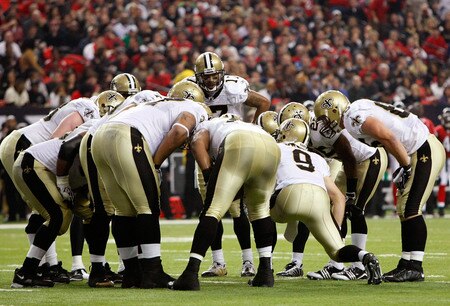 ATLANTA - DECEMBER 13:  Quarterback Drew Brees #9 of the New Orleans Saints huddles the offense against the Atlanta Falcons at Georgia Dome on December 13, 2009 in Atlanta, Georgia. The Saints won 26-23. <br /><br /><span class="help">(Photo by Kevin C. Cox/Getty Images)</span>