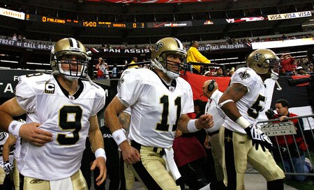 ATLANTA - DECEMBER 13:  Quarterback Drew Brees #9 and Mark Brunell #11 of the New Orleans Saints take the field against the Atlanta Falcons at Georgia Dome on December 13, 2009 in Atlanta, Georgia.  The Saints won 26-23. <br /><br /><span class="help">(Photo by Kevin C. Cox/Getty Images)</span>
