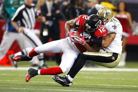 ATLANTA - DECEMBER 13:  Darren Sharper #42 of the New Orleans Saints tackles Michael Jenkins #12 of the Atlanta Falcons at Georgia Dome on December 13, 2009 in Atlanta, Georgia. The Saints won 26-23.  <br /><br /><span class="help">(Photo by Kevin C. Cox/Getty Images)</span>