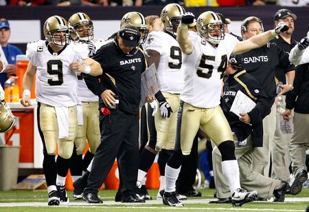 ATLANTA - DECEMBER 13:  Quarterback Drew Brees #9 and Troy Evans #54 of the New Orleans Saints rush onto the field after a turnover on downs by the Atlanta Falcons in the final minutes of regulation at Georgia Dome on December 13, 2009 in Atlanta, Georgia. The Saints won 26-23. <br /><br /><span class="help">(Photo by Kevin C. Cox/Getty Images)</span>