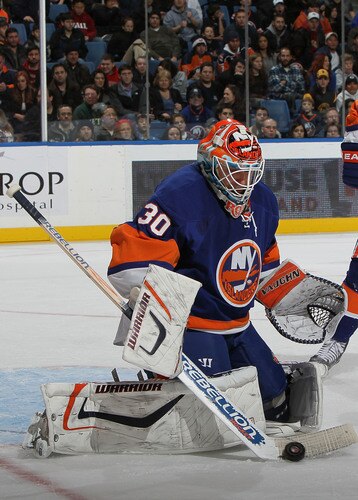 UNIONDALE, NY - DECEMBER 12:  Dwayne Roloson #30 of the New York Islandersmakes a save against the Boston Bruins during their game at the Nassau Coliseum on December 12, 2009 at the Nassau Coliseum in Uniondale, New York.  <br /><br /><span class="help">(Photo by Al Bello/Getty Images)</span>