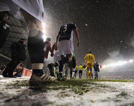 STOKE ON TRENT, ENGLAND - JANUARY 05: Players walk out onto the pitch as the snow falls  ahead of the Barclays Premier League match between Stoke City and Fulham at The Britannia Stadium on January 5, 2010 in Stoke on Trent, England.  <br /><br /><span class="help">(Photo by Laurence Griffiths/Getty Images)</span>