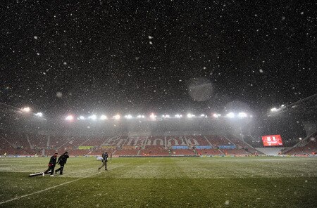 STOKE ON TRENT, ENGLAND - JANUARY 05:  Groundstaff try and keep the pitch clear of snow during the Barclays Premier League match between Stoke City and Fulham at The Britannia Stadium on January 5, 2010 in Stoke on Trent, England.  <br /><br /><span class="help">(Photo by Laurence Griffiths/Getty Images)</span>