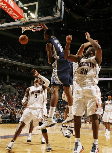 CHARLOTTE, NC - JANUARY 9:  Hasheem Thabeet #34 of the Memphis Grizzlies dunks against Gerald Wallace #3 of the Charlotte Bobcats on January 9, 2010 at the Time Warner Cable Arena in Charlotte, North Carolina.  <br /><br /><span class="help">(Photo by Brock Williams-Smith/NBAE via Getty Images)</span>