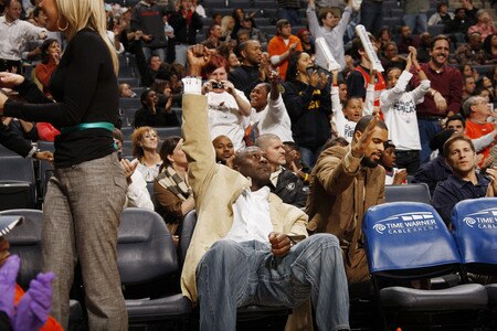 CHARLOTTE, NC - JANUARY 9:  Tyson Chandler #6 of the Charlotte Bobcats and Michael Jordan cheer over the win against the Memphis Grizzlies on January 9, 2010 at the Time Warner Cable Arena in Charlotte, North Carolina.  <br /><br /><span class="help">(Photo by Kent Smith/NBAE via Getty Images)</span>