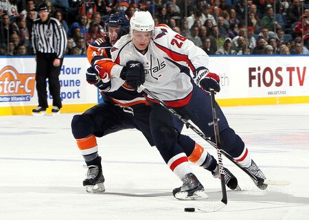 UNIONDALE, NY - JANUARY 26:  Andrew MacDonald #47 of the New York Islanders commits a holding penalty against Alexander Semin #28 of the Washington Capitals in the third period on January 26, 2010 at Nassau Coliseum in Uniondale, New York.  <br /><br /><span class="help">(Photo by Jim McIsaac/Getty Images)</span>