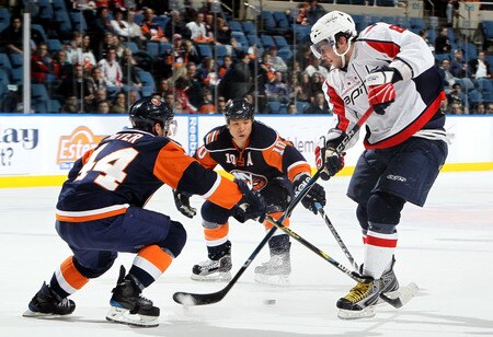 UNIONDALE, NY - JANUARY 26:  Alex Ovechkin #8 of the Washington Capitals is defended by Freddy Meyer #44 and Richard Park #10 of the New York Islanders on January 26, 2010 at Nassau Coliseum in Uniondale, New York.  <br /><br /><span class="help">(Photo by Jim McIsaac/Getty Images)</span>