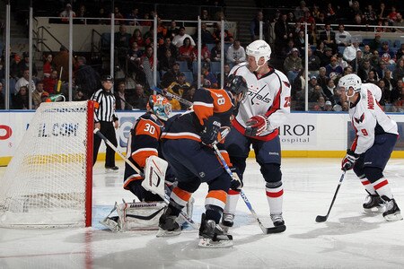 UNIONDALE, NY - JANUARY 26:  Brendan Morrison #9 of the Washington Capitals scores a first period goal past Dwayne Roloson #30 of the New York Islanders on January 26, 2010 at Nassau Coliseum in Uniondale, New York.  <br /><br /><span class="help">(Photo by Jim McIsaac/Getty Images)</span>