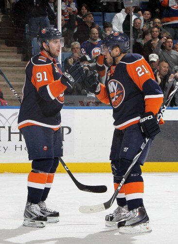 UNIONDALE, NY - JANUARY 26:  Kyle Okposo #21 of the New York Islanders celebrates his goal against the Washington Capitals with teammate John Tavares #91 on January 26, 2010 at Nassau Coliseum in Uniondale, New York.  <br /><br /><span class="help">(Photo by Jim McIsaac/Getty Images)</span>