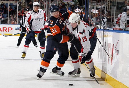 UNIONDALE, NY - JANUARY 26:  Nicklas Backstrom #19 of the Washington Capitals plays the puck against Kyle Okposo #21 of the New York Islanders on January 26, 2010 at Nassau Coliseum in Uniondale, New York.  <br /><br /><span class="help">(Photo by Jim McIsaac/Getty Images)</span>