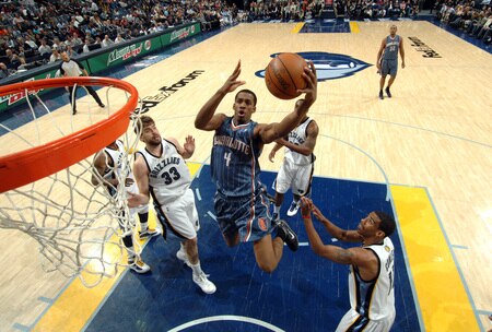 MEMPHIS, TN - FEBRUARY 26: Derrick Brown #4 of the Charlotte Bobcats shoots between Marc Gasol #33 and Mike Conley #11 of the Memphis Grizzlies on February 26, 2010 at FedExForum in Memphis, Tennessee.  <br /><br /><span class="help">(Photo by Joe Murphy/NBAE via Getty Images)</span>