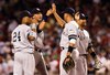 25 July 2008: Robinson Cano (24), Derek Jeter, Alex Rodriguez, and Bobby Abreu congratulate each other after the New York Yankees win over the Boston Red Sox 1-0 at Fenway Park in Boston, MA.