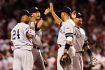 25 July 2008: Robinson Cano (24), Derek Jeter, Alex Rodriguez, and Bobby Abreu congratulate each other after the New York Yankees win over the Boston Red Sox 1-0 at Fenway Park in Boston, MA.