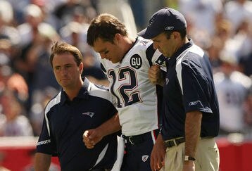 Brady-helped-off-field_feature