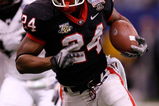 NEW ORLEANS - JANUARY 01:  Knowshon Moreno #24 of the Georgia Bulldogs runs the ball against the Hawai'i Warriors during the Allstate Sugar Bowl at the Louisiana Superdome on January 1, 2008 in New Orleans, Louisiana. Georgia won 41-10.  (Photo by Chris Graythen/Getty Images)