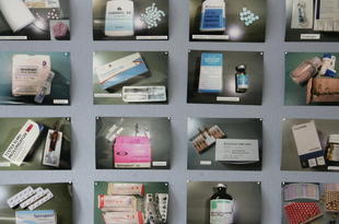 BERLIN - AUGUST 29:  Photos of anabolic steroids confiscated in a police bust earlier in the day stand on display at police headquarters August 29, 2006 in Berlin, Germany. Police in the German states of Berlin, Lower Saxony and Brandenburg as well as in Poland searched a total of 45 residences and athletic studios and made 8 arrests in what appears to be a gang specialized in the illegal trade of anabolic steroids. Police said hundreds of people, mostly weightlifting enthusiasts in Germany, are thought to have to have bought steroids from the gang, who smuggled the substances into Germany from countries including Thailand, Poland and Russia.  (Photo by Sean Gallup/Getty Images)
