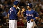 ARLINGTON, TX - JULY 11:  Michael Young #10 of the Texas Rangers celebrates scoring a run with David Murphy #7 during action against the Chicago White Sox in the 6th inning on July 11, 2008 at Rangers Ballpark in Arlington, Texas.  (Photo by Ronald Martinez/Getty Images)