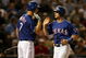 ARLINGTON, TX - JULY 11:  Michael Young #10 of the Texas Rangers celebrates scoring a run with David Murphy #7 during action against the Chicago White Sox in the 6th inning on July 11, 2008 at Rangers Ballpark in Arlington, Texas.  (Photo by Ronald Martinez/Getty Images)