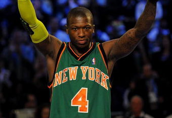 PHOENIX - FEBRUARY 14:  Nate Robinson of the New York Knicks waves to the crowd after winning the Sprite Slam Dunk Contest on All-Star Saturday Night, part of 2009 NBA All-Star Weekend at US Airways Center on February 14, 2009 in Phoenix, Arizona.  NOTE TO USER: User expressly acknowledges and agrees that, by downloading and or using this photograph, User is consenting to the terms and conditions of the Getty Images License Agreement.  (Photo by Ronald Martinez/Getty Images)