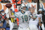 MIAMI, FL - JANUARY 4:  Quarterback Chad Pennington #10 of the Miami Dolphins sets to pass against the Baltimore Ravens in an NFL Wildcard Playoff Game at Dolphins Stadium on January 4, 2009 in Miami, Florida.  (Photo by Al Messerschmidt/Getty Images) 